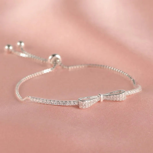 Silver bracelet with clear stones on a blurred background