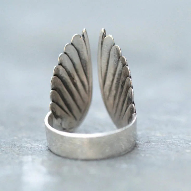 Angel wing sterling silver ring worn on finger delicate style