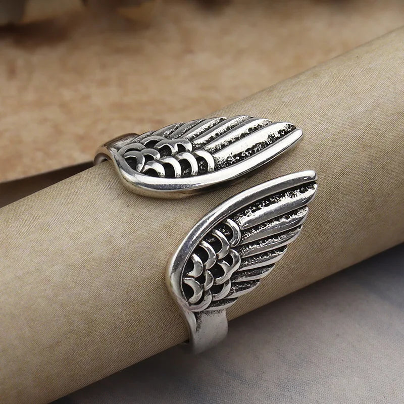 Handcrafted angel wing silver ring detailed feather texture