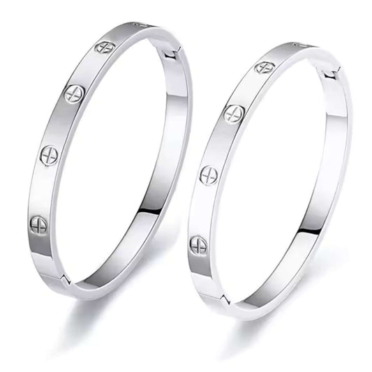 Silver Bangle with engraved symbols on a white background